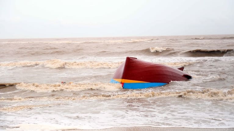 A boat is washed ashore in Quang Tri, Vietnam after Typhoon Bualoi went through the area. (Vo Ta Chuyen/VNA via AP