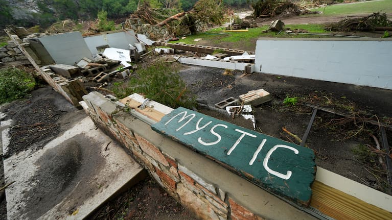 A Camp Mystic sign is seen near the entrance to the establishment along the banks of the Guadalupe River in Hunt, Texas, July 5, 2025, after a flash flood swept through the area.