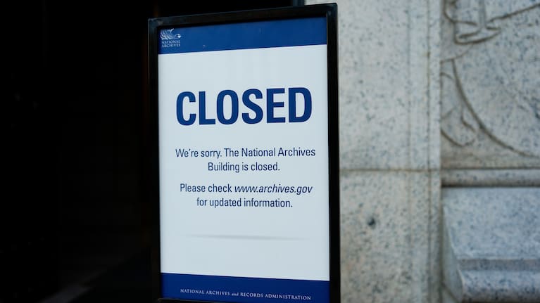 A closed sign stands in front of the National Archives on the first day of a government shutdown