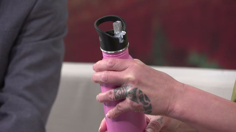 A drink bottle with a plastic straw built in.