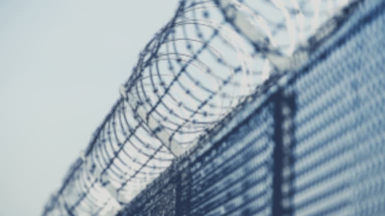 A file image of a prison fence.