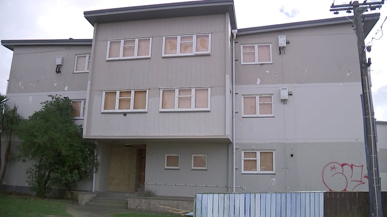 A Kāinga Ora housing complex scrawled with graffiti.
