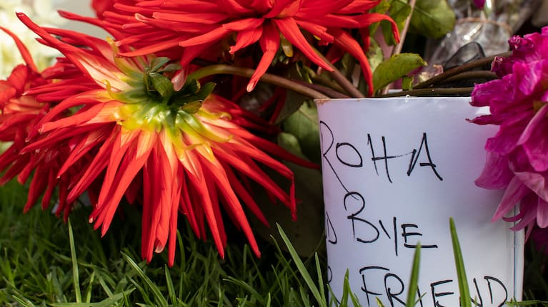 A note reading, "Aroha, goodbye dear friend" left alongside flowers at the site of a crash between a cyclist and a truck on Lake Road, Belmont.