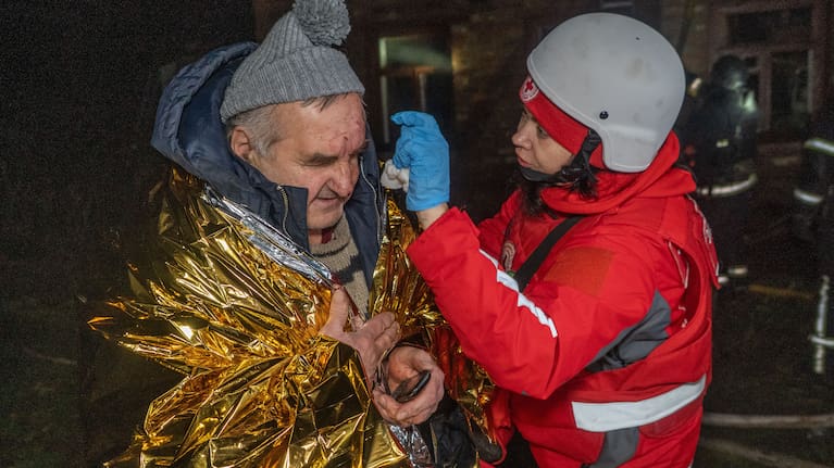 A paramedic gives first aid to a resident who was injured in a Russian airstrike in Kharkiv, Ukraine.