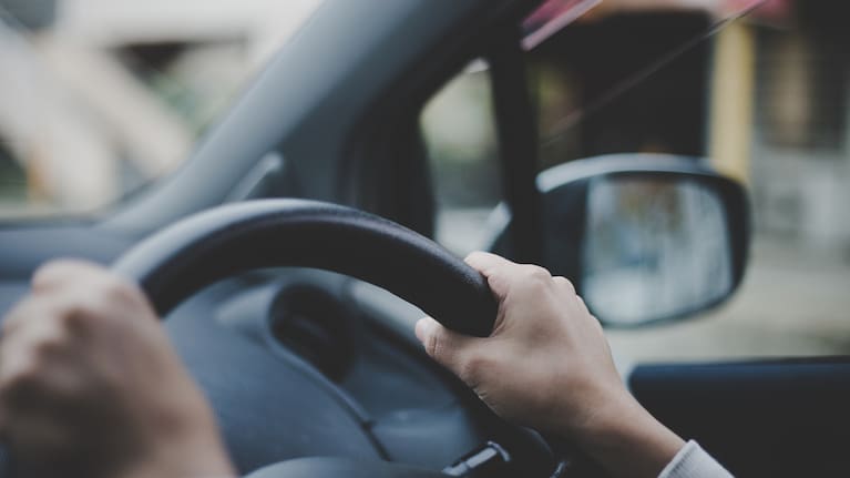 A person driving a car.