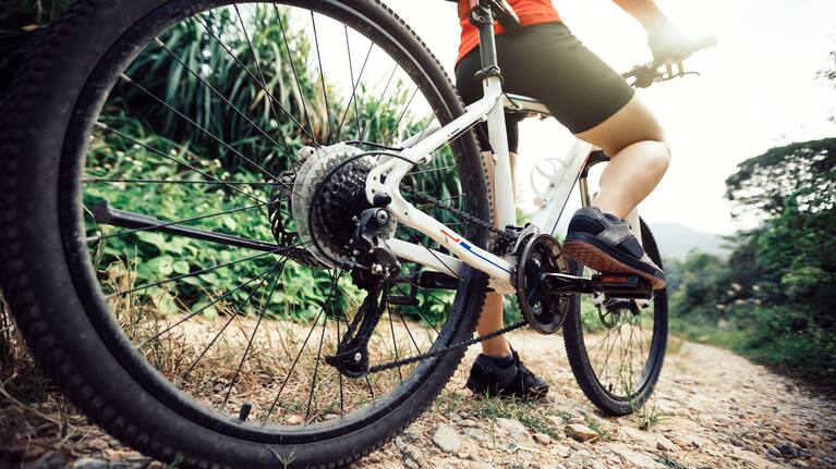 A person riding a mountain bike on a trail (file).