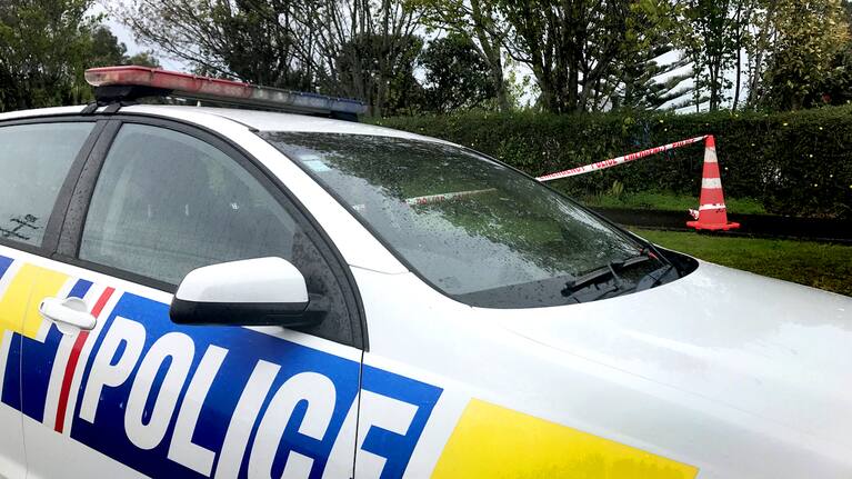 A Police car at the scene of an investigation.