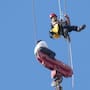 A teenager is rescued from a crane platform atop a skyscraper, where he dangled 36 stories up in the air for seven hours, in Jerusalem.