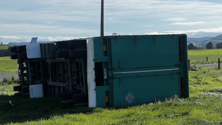 A trailer lies on it's side following yesterday's high winds.