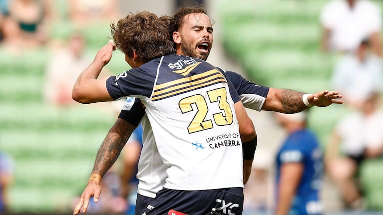 Brumbies wing Adam Muirhead celebrates at the final whistle with Ollie Sapsford.