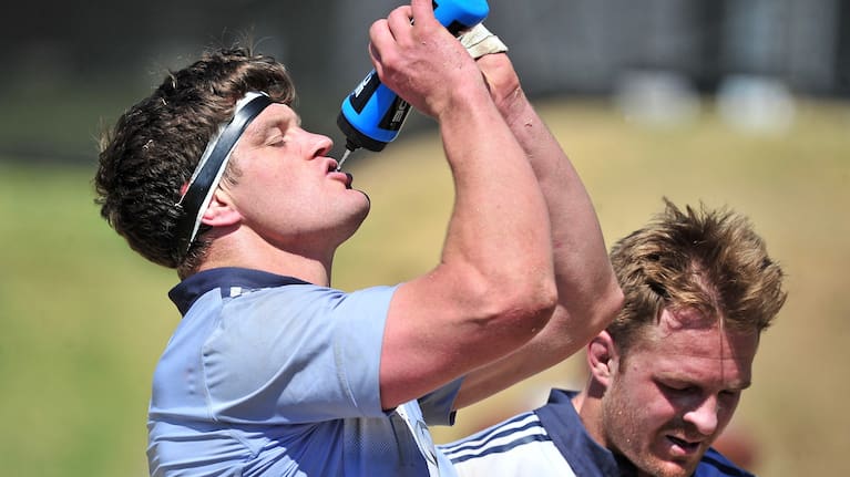 All Blacks captain Scott Barrett, left, and former skipper Sam Cane take a break in training under the bright sun in Johannesburg.