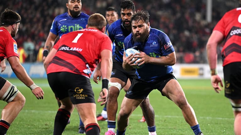 Angus Ta'avao carries the ball into the heart of the Crusaders' pack during the Blues' loss in Christchurch.