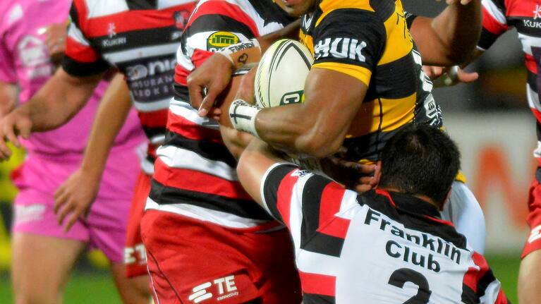 Angus Ta'Avao of Taranaki in the tackle of Suliasi Taufalele during the ITM cup rugby union match, Taranaki v Counties Manukau played at yarrow Stadium, New Plymouth, New Zealand. Thursday 14th August 2014.
Photo John Velvin/www.photosport.co.nz