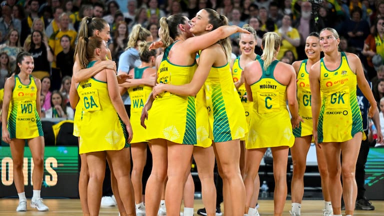 Australia celebrate after beating the Silver Ferns in Melbourne.