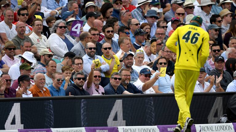 LONDON, ENGLAND - JUNE 13: Cricket fans wave sandpaper four cards at Ashton Agar of Australia during the 1st Royal London ODI match between England and Australia at The Kia Oval on June 13, 2018 in London, England. (Photo by Gareth Copley/Getty Images)