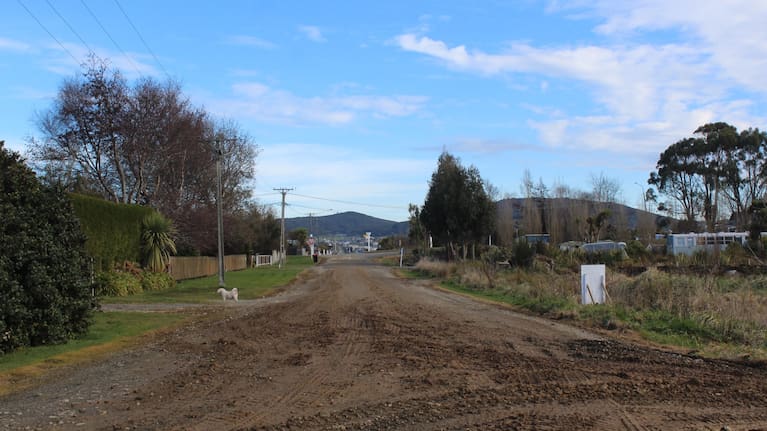 Boniface says her street is dusty in the summer and muddy in the winter.