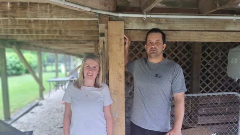 Brendon and Stephanie Deacon at their property that was considered category one by Auckland Council despite their neighbours all being category three following flooding.