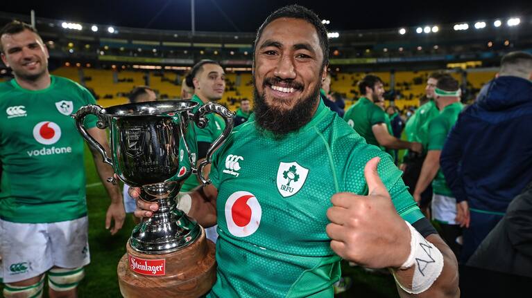Ireland's Bundee Aki, a New Zealander, celebrates with the series trophy in Wellington.