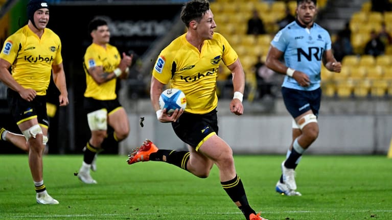 Cam Roigard runs in for a try for the Hurricanes against the Waratahs.