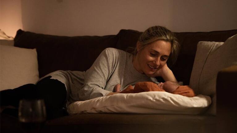 Charlotte Bellis with her newborn daughter.
