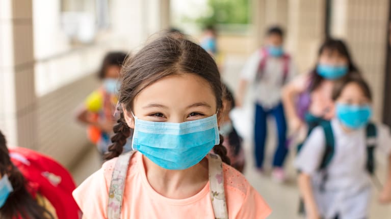 Kids with masks on at school.
