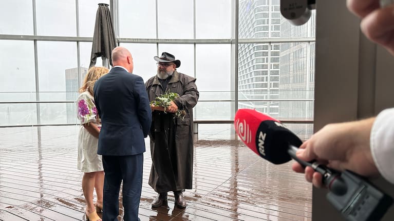 Christopher Luxon participating in a traditional welcome to country smoke ceremony in Sydney.