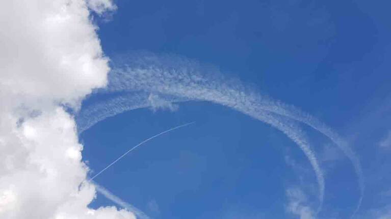 Contrails left over Auckland by Defence Force plane