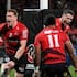 Dallas McLeod, left, Sevu Reece and Will Jordan celebrate the Crusaders' semifinal win over the Blues.