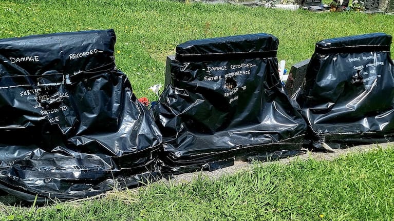 Damage to the graves of Kiwi motorsport icon Bruce McLaren and his wife Patricia.