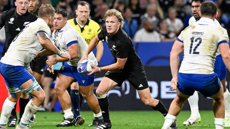Damian McKenzie makes a break for the All Blacks against Italy during the World Cup.