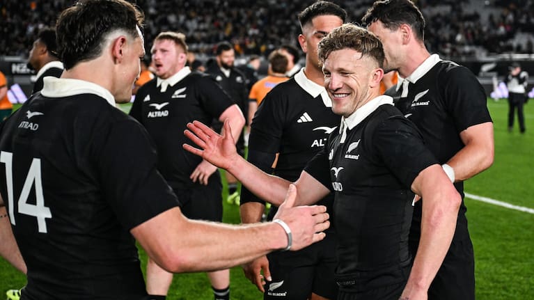 Damian McKenzie celebrates the All Blacks' Bledisloe Cup win over the Wallabies with Leroy Carter.