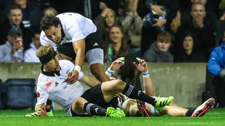 Damian McKenzie scores the try to put the All Blacks ahead of Scotland at Murrayfield.