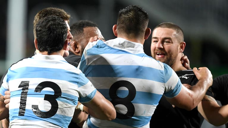 Dane Coles and Pablo Matera check out each other's jerseys in Hamilton.