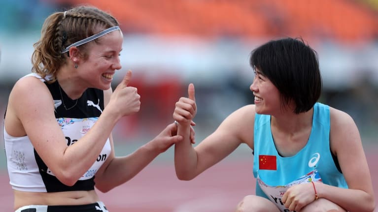 Danielle Aitchison and Yiting Shi celebrate their rivalry at the world para athletics championships.