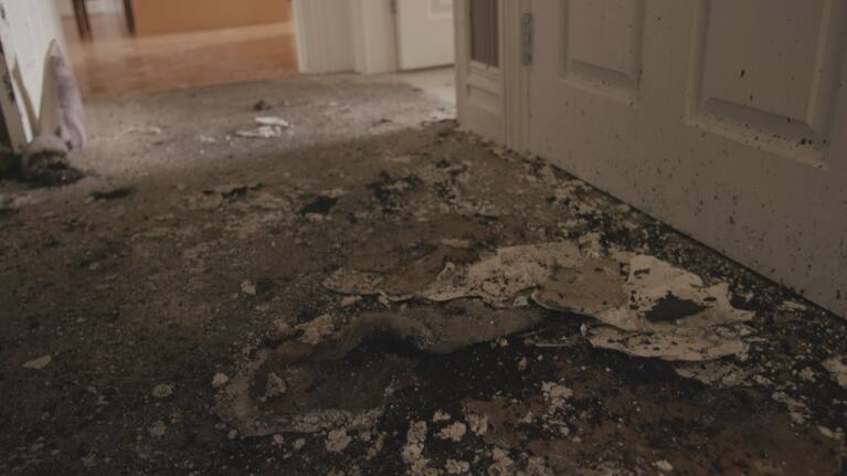 Debris on the floor of Suzanne Fryer's home following a house fire in Greytown.