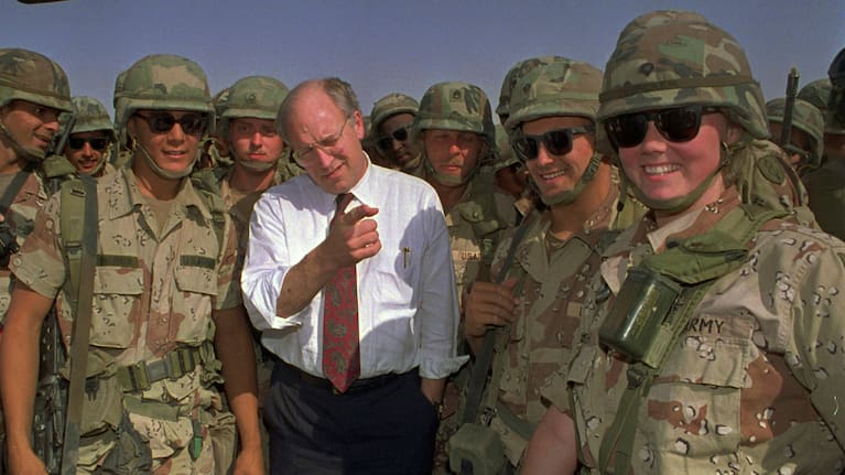 Defense Secretary Dick Cheney poses with some of the US Army troops stationed in southern Iraq in this May 7, 1991 file photo.