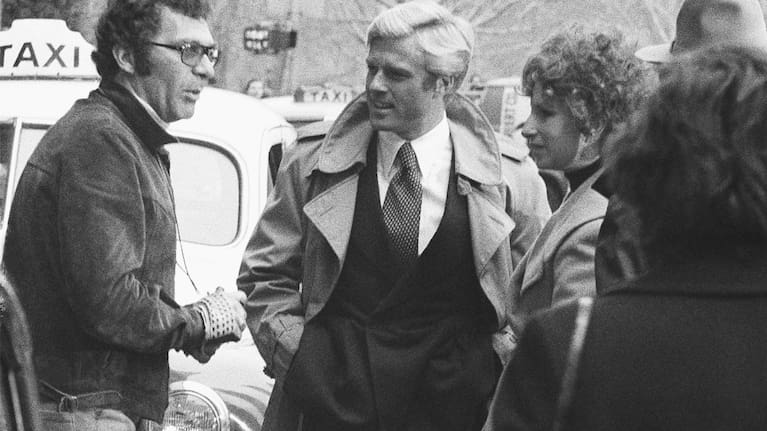 Director Sydney Pollack, left, appears with actors Robert Redford, centre, and Barbra Streisand during the filming of The Way We Were in New York in 1972.