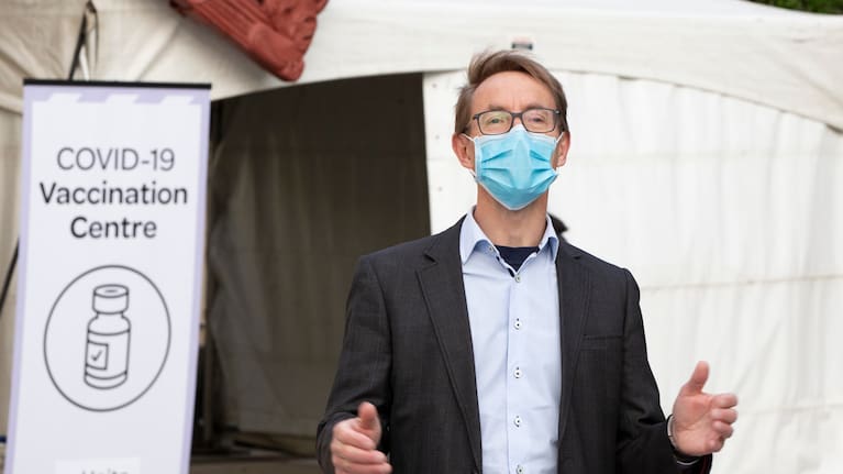 WELLINGTON, NEW ZEALAND - AUGUST 22: New Zealand Director-General Dr. Ashley Bloomfield speaks at the Pipitea Marae vaccination centre where he received his first vaccination for COVID-19 on August 22, 2021 in Wellington, New Zealand. All of New Zealand is subject to Alert Level 4 restrictions until at least 11:59 pm Tuesday, August 24. Cabinet will meet on Monday to review the restrictions. Under COVID-19 Alert Level 4 measures, people are required to stay at home in their bubble other than for essential reasons, with travel severely limited. All non-essential businesses are closed, including bars, restaurants, cinemas and playgrounds. All indoor and outdoor events are banned, while schools have switched to online learning. Essential services remain open, including supermarkets and pharmacies. (Photo by Ross Giblin-Pool/Getty Images)