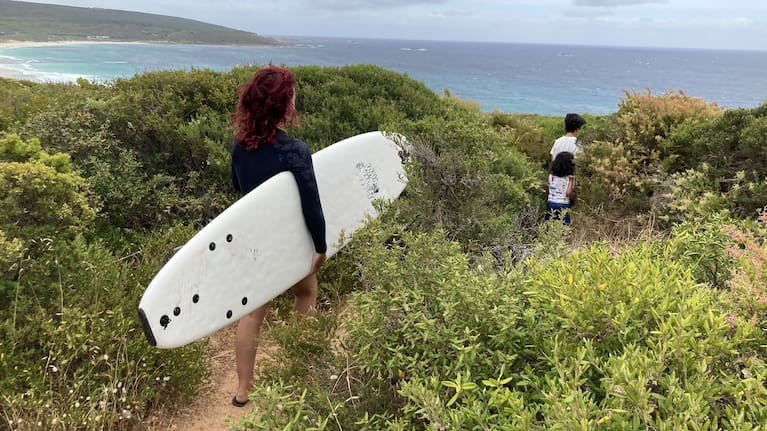 Duff on the hunt for waves in Yallingup, Western Australia. Her sons, aged eight and four, lead the way.