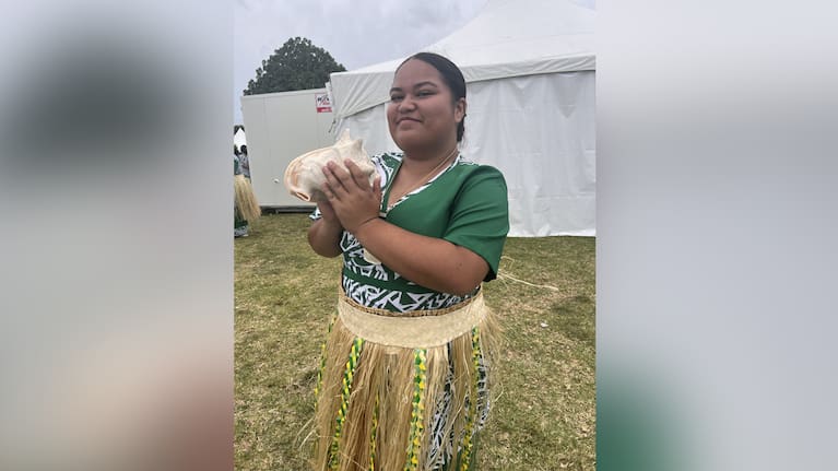 Eden Enelio from McAuley High School beams backstage after performing with her school’s Tokelau group, calling it “overwhelming, but really fun".