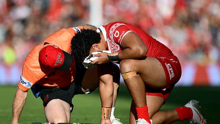 Eliesa Katoa of Tonga is attended to by a trainer