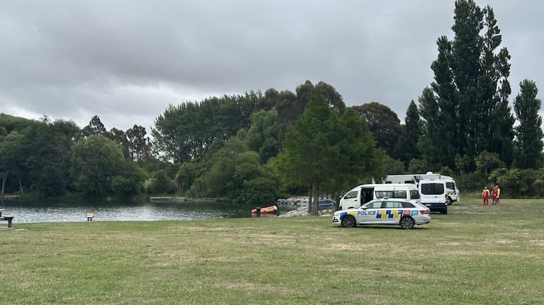 Emergency services at the lake where a man is missing near Johns Rd, Christchurch.