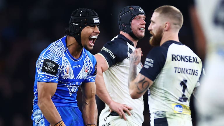 Stephen Crichton of Samoa celebrates after kicking a dropped goal, leading to Samoa winning the game.