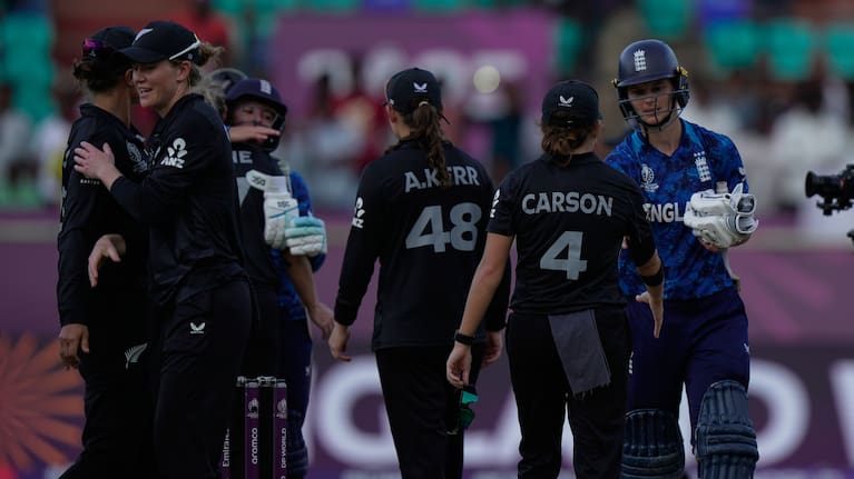 England's Amy Jones, extreme right, shake hands with New Zealand's players after winning the ICC Women's Cricket World Cup match.