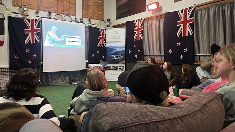 Fans watching Lulu Sun's Wimbledon quarterfinal at the Te Anau Tennis Club.