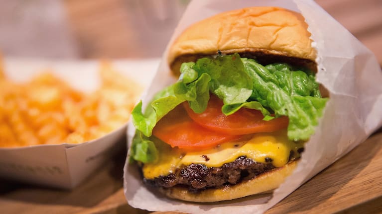 A cheeseburger and french fries. 