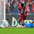 Finn Surman of New Zealand scores a goal against Norway.