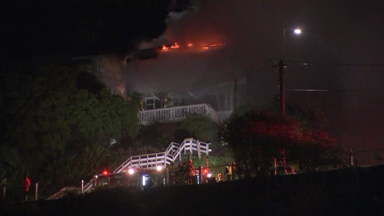 Fire and Emergency services respond to a fire engulfing two houses in Lyttleton, Christchurch.