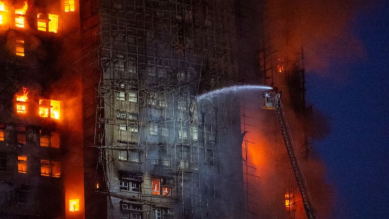 Firefighters work to extinguish a fire which broke out at Wang Fuk Court, a residential estate in the Tai Po district of Hong Kong's New Territories, Wednesday, November 26 (local time) 2025.
