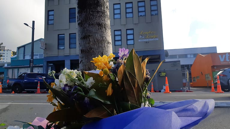 Flowers laid in tribute near Loafers Lodge.